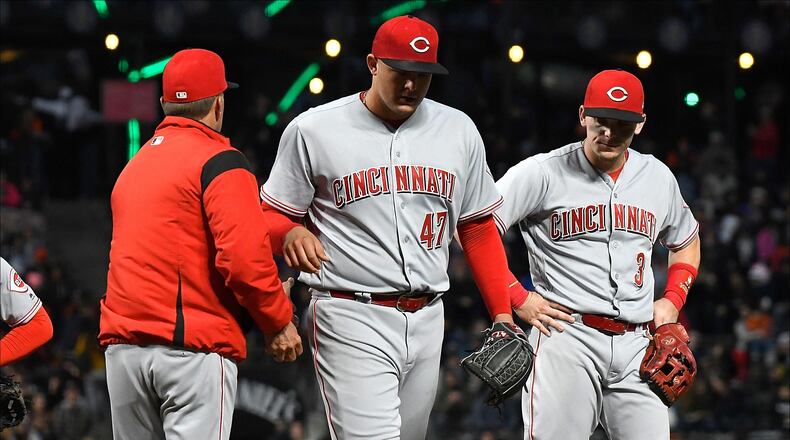 SAN FRANCISCO, CA - MAY 14:  Interim manager Jim Riggleman #35 of the Cincinnati Reds takes the ball from starting pitcher Sal Romano #47 taking Romano out of the game against the San Francisco Giants in the bottom of the third innng at AT&T Park on May 14, 2018 in San Francisco, California.  (Photo by Thearon W. Henderson/Getty Images)