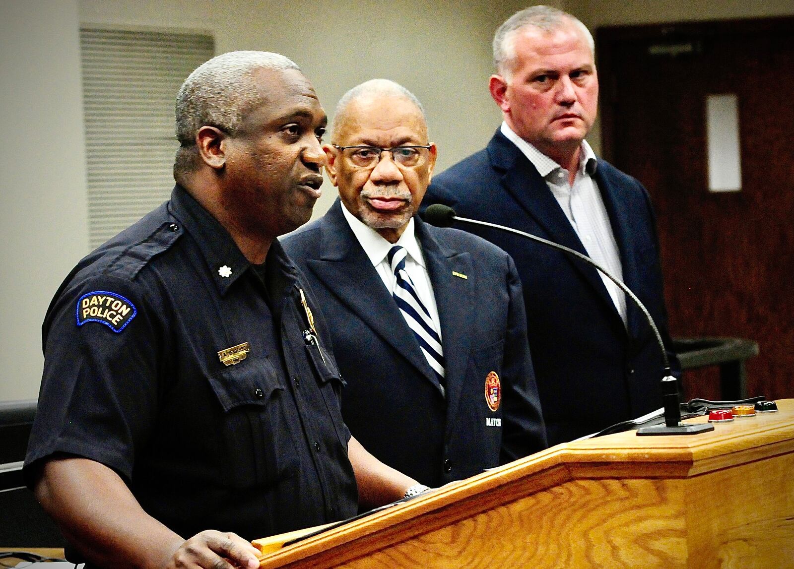Lt. Col. Eric Henderson of the Dayton Police Department, Dayton Mayor Jeffrey Mims, Jr and Deputy City Manager Joe Parlette talked to the media Wednesday, June 26, 2024 about multiple shootings earlier this week that injured 13 and killed 2. MARSHALL GORBY\STAFF