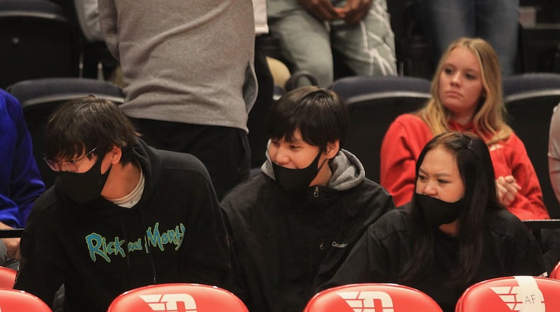 Enkhiin-Od Michael Sharavjamts, a recruit in the 2022 class, watches a game between Dayton and Cedarville in an exhibition game on Monday, Nov. 1, 2021, at UD Arena. David Jablonski/Staff