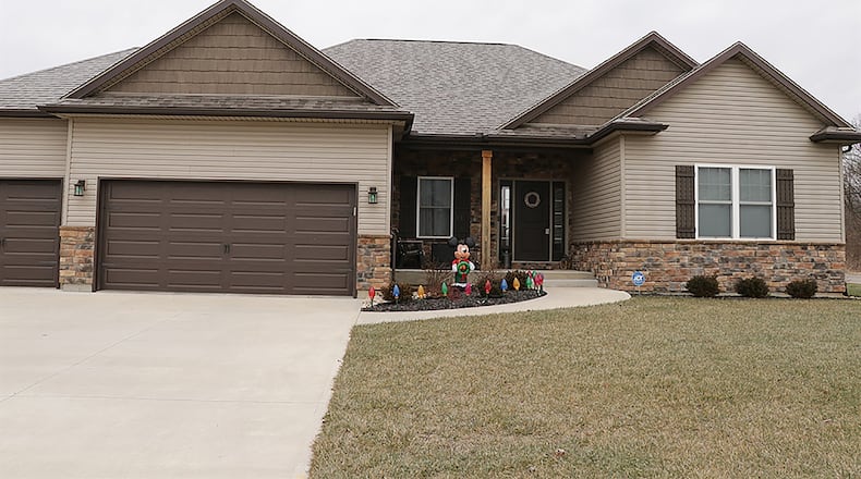 The ranch, which has about 3,880 sq. ft. of living space, sits on a corner lot with an oversized concrete driveway that leads to the 3-car attached garage. Young landscaping includes a garden island as a concrete walk curves up the covered front porch. CONTRIBUTED PHOTO BY KATHY TYLER