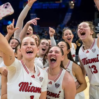The Miami University women’s basketball team celebrates after winning a Mid-American Conference Tournament game. MIAMI ATHLETICS PHOTO