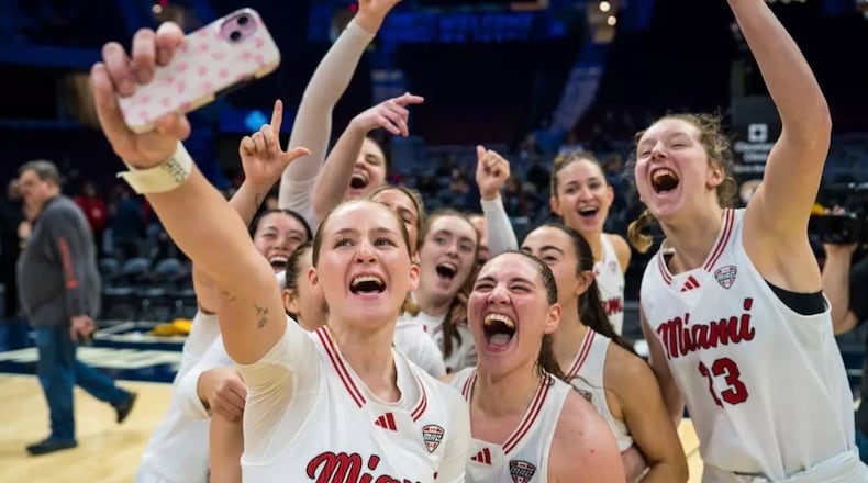The Miami University women’s basketball team celebrates after winning a Mid-American Conference Tournament game. MIAMI ATHLETICS PHOTO