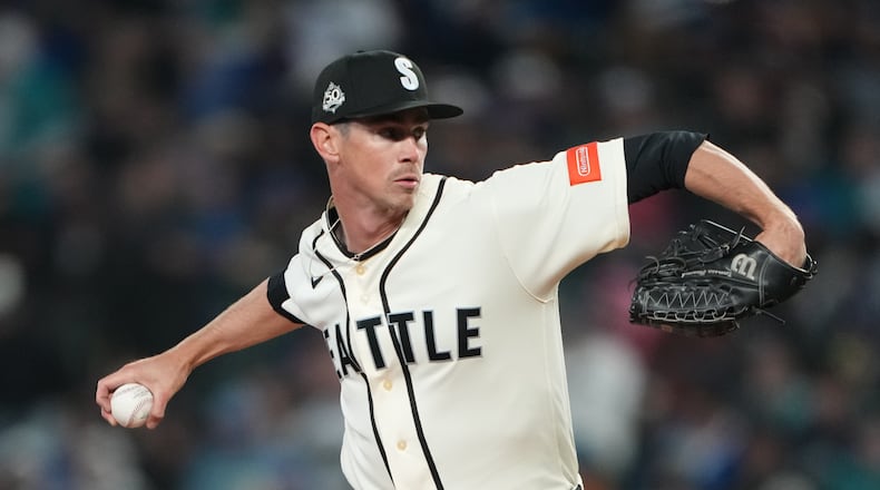 Seattle Mariners starting pitcher Emerson Hancock throws against the Cleveland Guardians during the third inning of a baseball game, Sunday, March 29, 2026, in Seattle. (AP Photo/Lindsey Wasson)