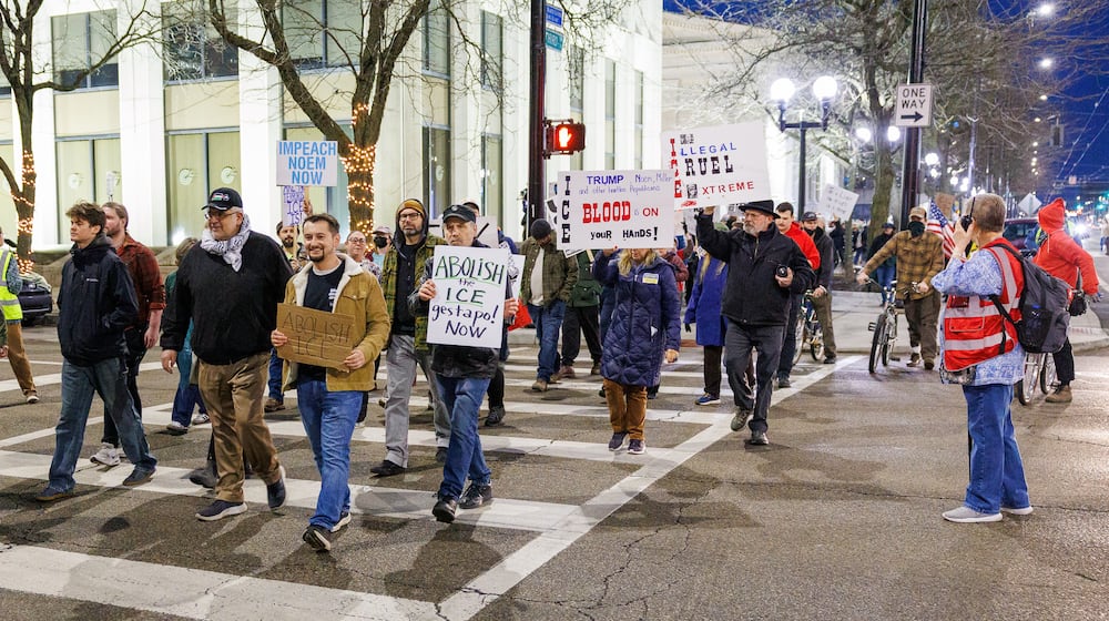 Demonstrators cross North Ludlow Street while marching on West Third Street near Courthouse Square on their way to Walter H. Rice Federal Building on Thursday, Jan. 8 during the Dayton to Minneapolis Stop ICE Terror protest. The protest was organized by a local chapter of the Party for Socialism and Liberation. BRYANT BILLING/STAFF