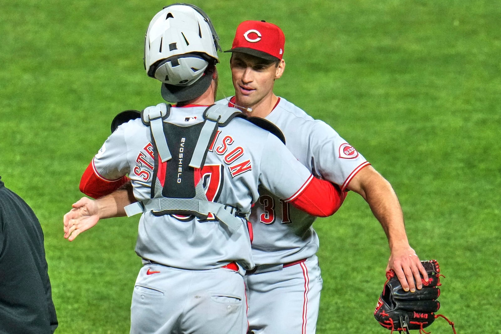 Cincinnati Reds pitcher Brent Suter, right, celebrates with catcher Tyler Stephenson, left, after getting the final out of a baseball game against the Pittsburgh Pirates in Pittsburgh, Monday, May 19, 2025. (AP Photo/Gene J. Puskar)