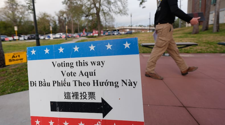 A voter makes his way into a polling location, Tuesday, March 3, 2026, in Spring, Texas. (AP Photo/David J. Phillip)