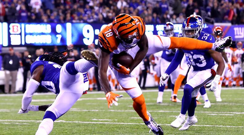 EAST RUTHERFORD, NJ - NOVEMBER 14: A.J. Green #18 of the Cincinnati Bengals catches a touchdown pass against Janoris Jenkins #20 of the New York Giants during the first quarter of the game at MetLife Stadium on November 14, 2016 in East Rutherford, New Jersey. (Photo by Al Bello/Getty Images)