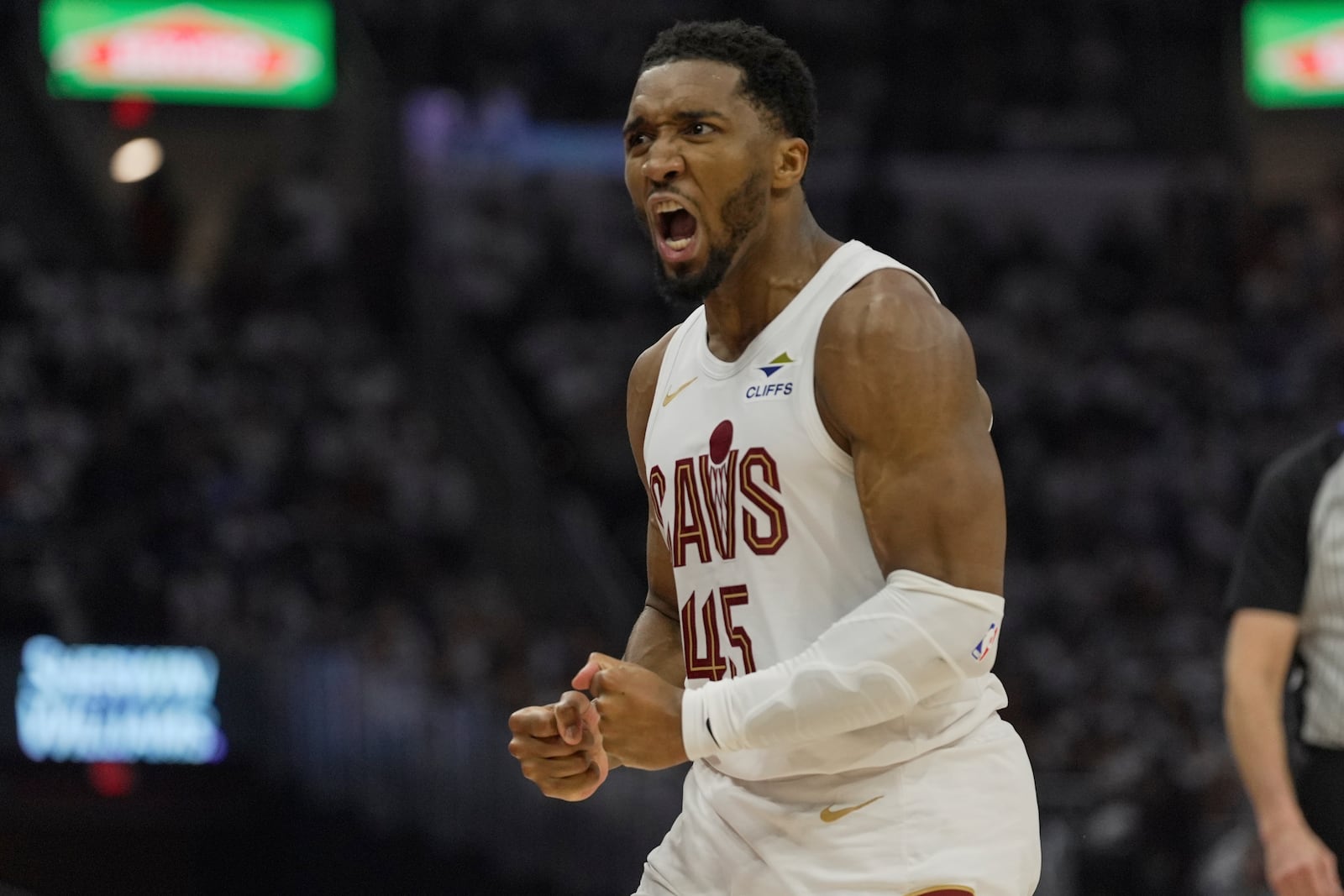 Cleveland Cavaliers guard Donovan Mitchell (45) reacts in the first half half in Game 1 of an NBA first-round playoff series against the Miami Heat, Sunday, April 20, 2025, in Cleveland. (AP Photo/Sue Ogrocki)