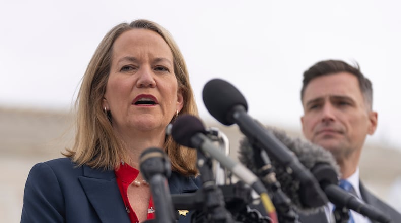 FILE - Arizona Attorney General Kris Mayes speaks to reporters as Oregon Attorney General Dan Rayfield listens outside the Supreme Court, on Nov. 5, 2025, in Washington. (AP Photo/Mark Schiefelbein, File)