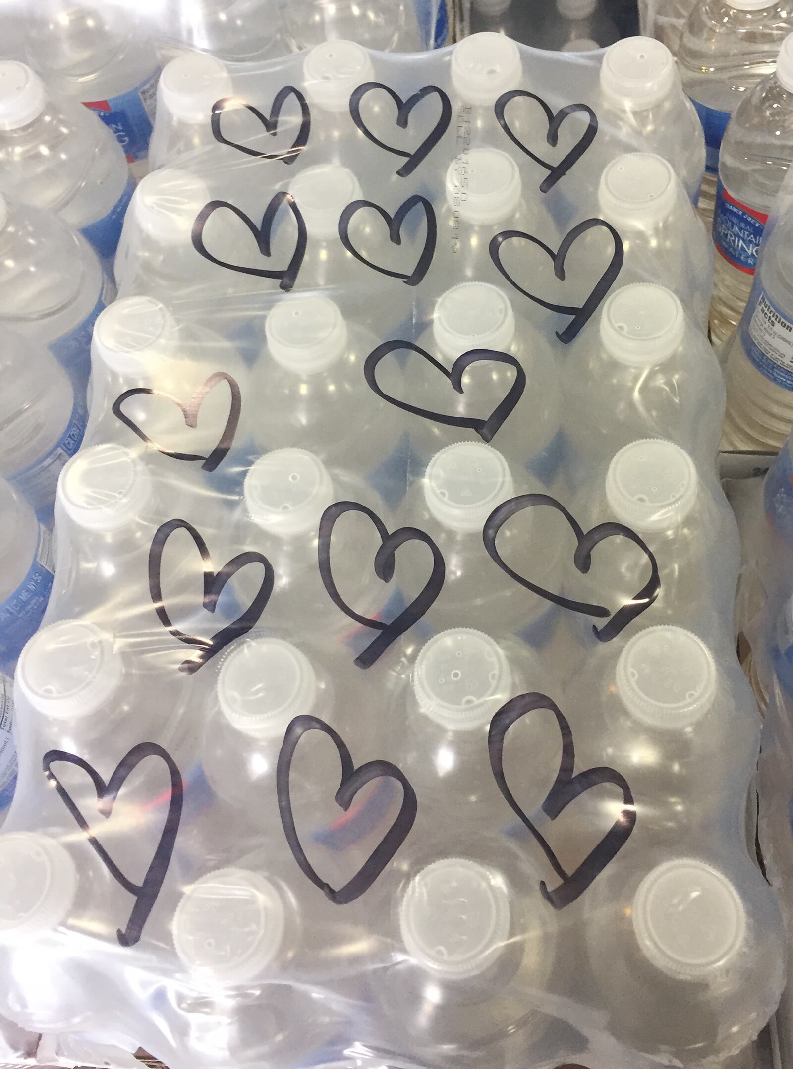 Messages have been left at The Foodbank in Dayton on donated cases of water and pallets bound to victims of Harvey in Texas. SUBMITTED