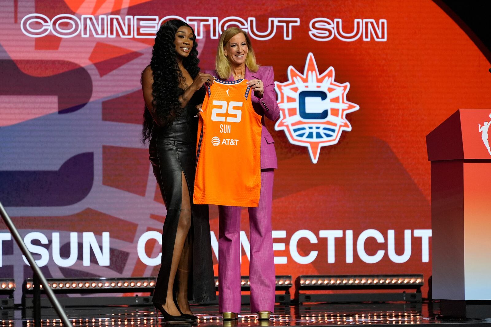 LSU's Aneesah Morrow, left, poses with WNBA commissioner Cathy Engelbert after being selected seventh overall by the Connecticut Sun during the first round of the WNBA basketball draft, Monday, April 14, 2025, in New York. (AP Photo/Pamela Smith)