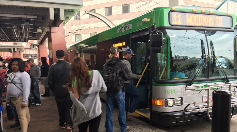 Riders gather to catch buses at the Greater Dayton Regional Transit Authority hub downtown on April 21.