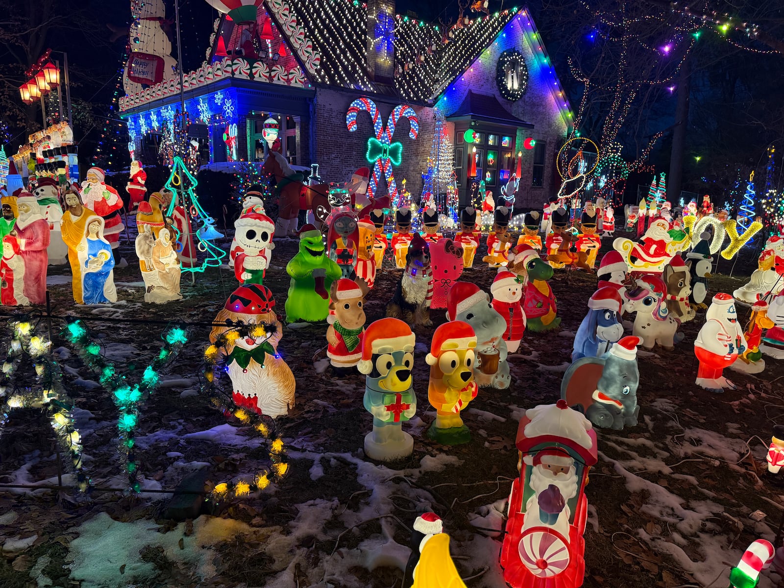 Each holiday season, Richard Smith teams up with his son Alex to put up a massive lights display in front of his home in Piqua. Photos by Alex Cutler