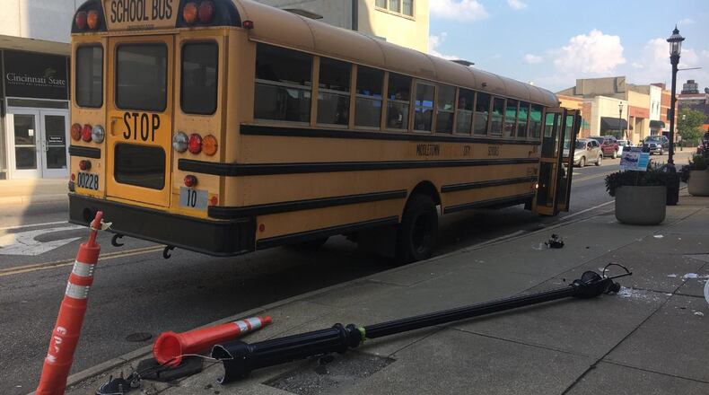 A Middletown City Schools bus allegedly hit light post at the corner of Central Avenue and South Main Street this afternoon. RICK McCRABB / STAFF