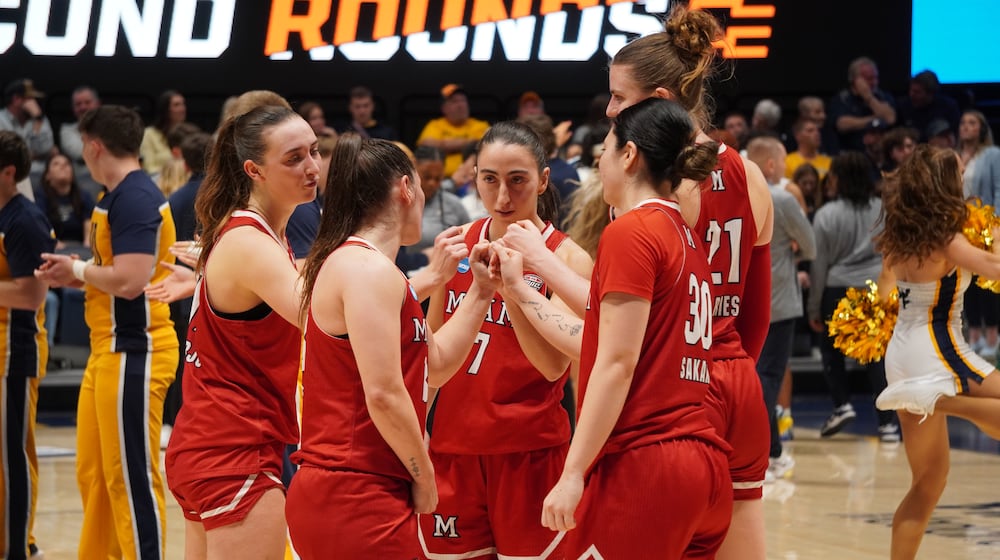 Miami University women's basketball players break a huddle during their NCAA Tournament game against West Virginia on Saturday, March 21, 2026, at Hope Coliseum in Morgantown, W.Va. CHRIS VOGT / CONTRIBUTED
