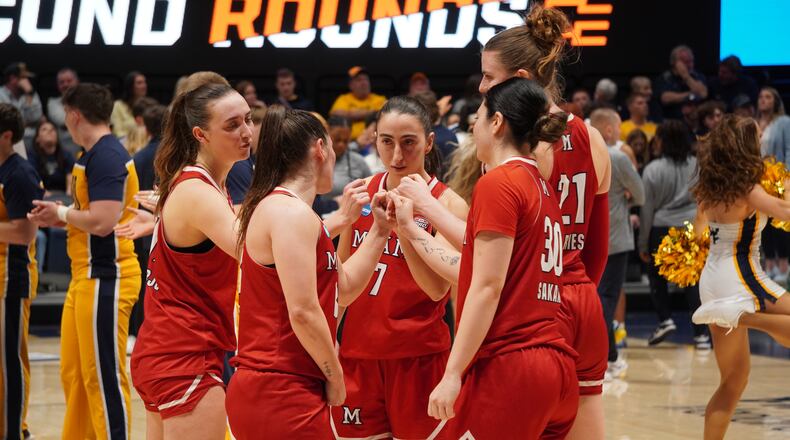 Miami University women's basketball players break a huddle during their NCAA Tournament game against West Virginia on Saturday, March 21, 2026, at Hope Coliseum in Morgantown, W.Va. CHRIS VOGT / CONTRIBUTED