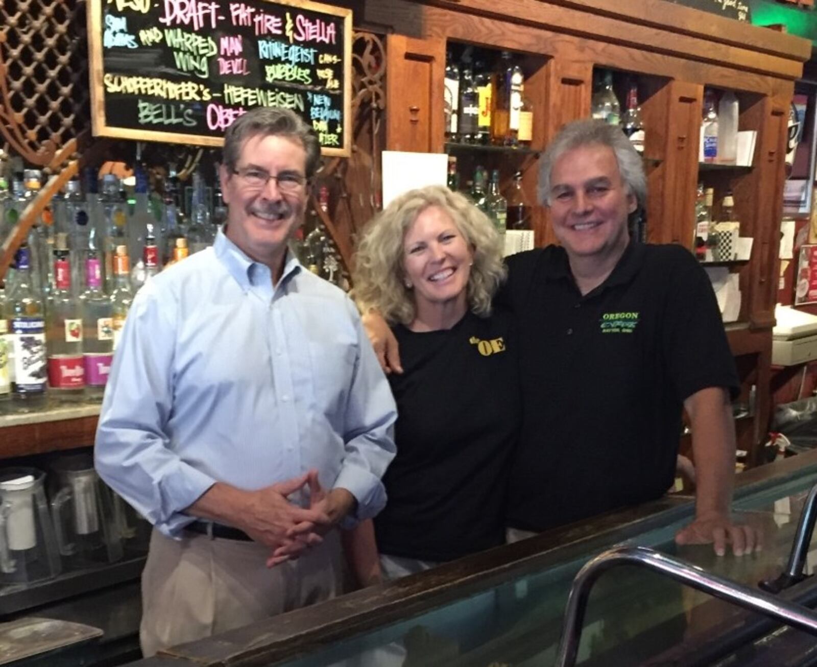 Terry Adkins (left), Susan and Joe Bavaro, owners of the Oregon Express Bar & Restaurant in Dayton’s Oregon Historic District. SUBMITTED