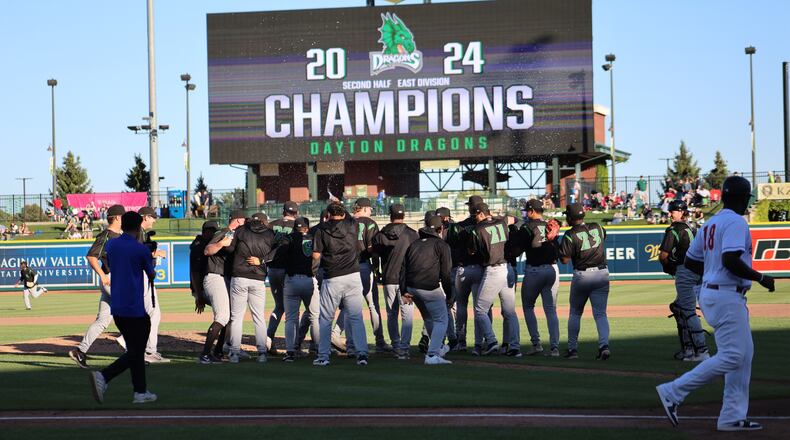 The Dayton Dragons celebrate moments after beating Great Lakes to clinch a playoff berth for the first time since 2017 with a 1-0 win on Sept. 2, 2024. The Dragons, the Midwest League East Division second-half champions, will host a first-round playoff game on Tuesday at Day Air Ballpark. CONTRIBUTED