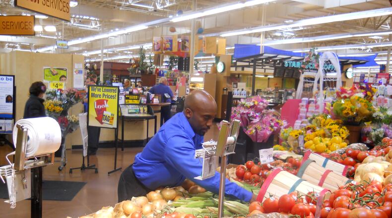 A produce manager at Kroger at work. FILE
