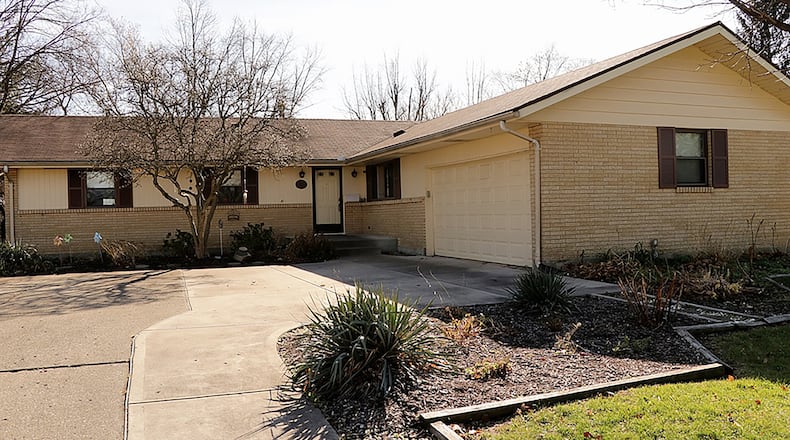 The ranch has about 2,640 sq. ft. of living space plus the full basement and a screen-enclosed patio. A concrete driveway leads up to the side-entry, 2-car garage that gives the house an L-shaped appearance. CONTRIBUTED PHOTO BY KATHY TYLER