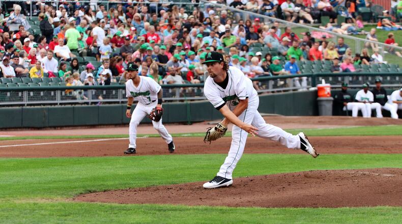 Dayton’s Patrick McGuff sends a pitch plateward during Monday night’s game vs. Lansing at Fifth Third Field. Michael Cooper/CONTRIBUTED