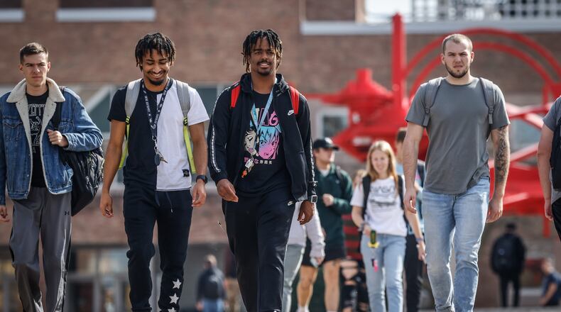 Wright State University students walk on campus on Monday, Oct. 24. Wright State has seen more than a 13% rise in first-time, undergraduate students this fall semester, an upward trend for the university who has seen more than 39% of its enrollment drop between 2017 and 2022. JIM NOELKER / STAFF