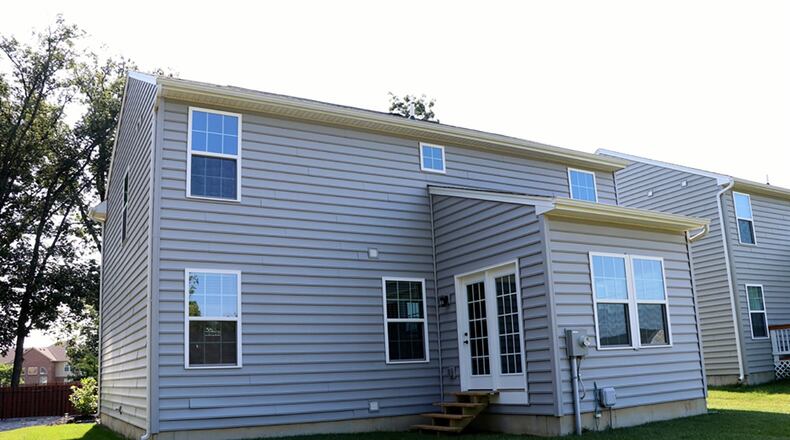 A morning room looks out over the open back yard that has no rear neighbors. The two-story has a finished basement that includes a recreation room and a full bathroom.