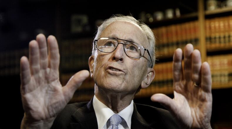 U.S. District Court Senior Judge Walter H. Rice discusses race relations in Dayton on Tuesday, June 30, 2015, in his chambers at the Federal Building in Dayton. CHRIS STEWART / STAFF