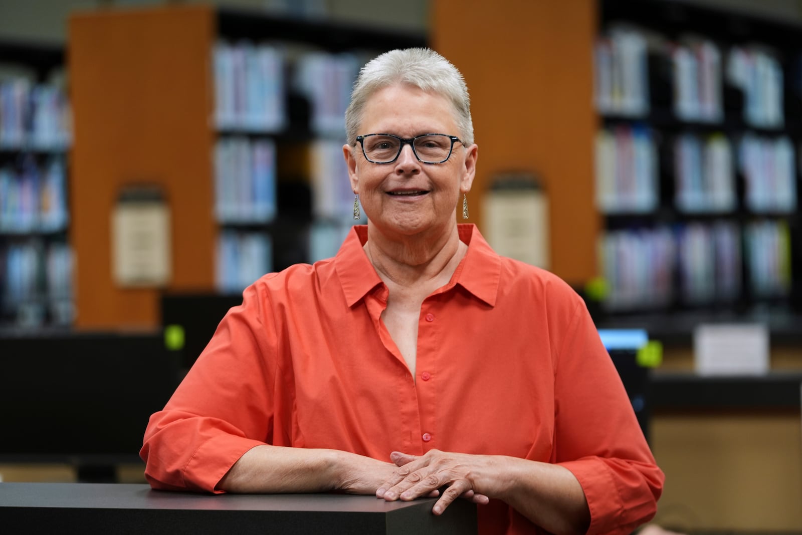 Lisa Brakel poses at the Bedford Branch Library in Temperance, Mich., Tuesday, May 6, 2025. (AP Photo/Paul Sancya)
