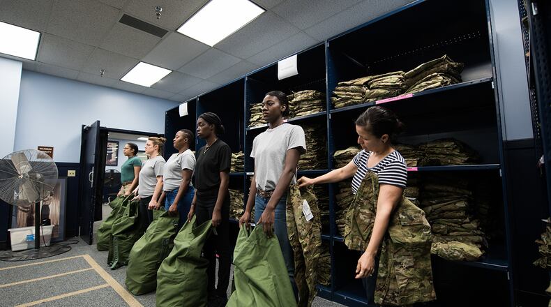 U.S. Air Force basic military training trainees, 326th Training Squadron, receive the first operational camouflage pattern (OCP) uniforms during initial issue, Oct. 2, 2019, at Joint Base San Antonio-Lackland, Texas. The OCP uniforms were made available for purchase for Airmen on Oct. 1, 2018. The mandatory wear date is Apr. 1, 2021. The OCP uniforms work in all climates and across the spectrum of the Air Force mission. They also contribute to the joint warfighting excellence and close ties between the Air Force and the Army. (U.S. Air Force photo by Sarayuth Pinthong)
