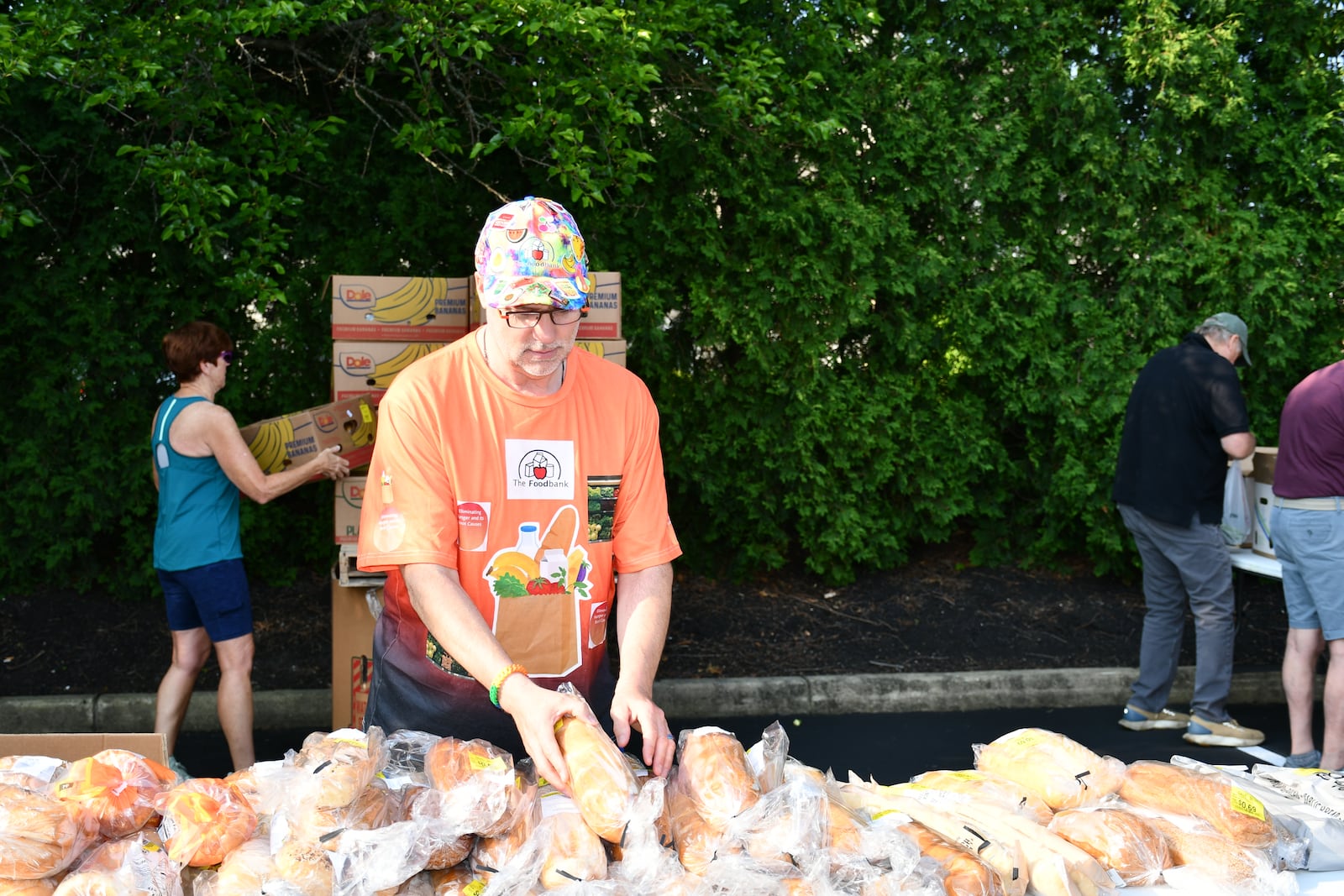 Volunteer Jay Ellis helps set up a mobile food distribution for The Foodbank.
CONTRIBUTED