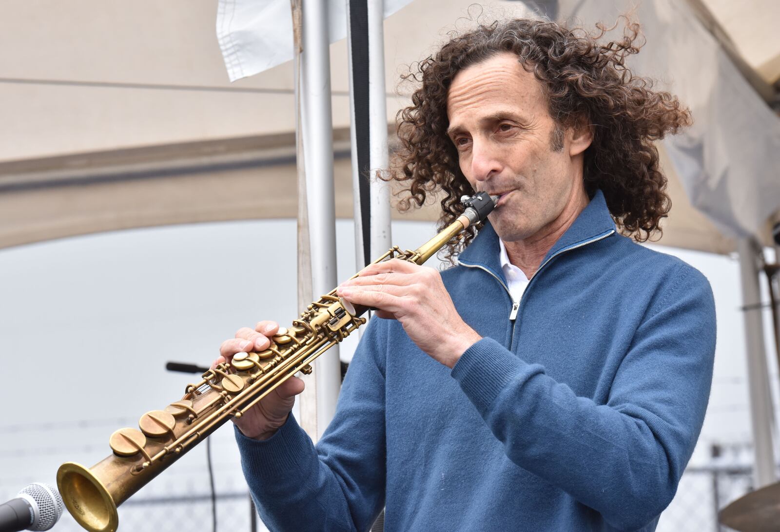 May 5, 2017 Atlanta - Kenny G performs during the 8th annual Jet Drag on Friday, May 5, 2017. Teams, of no more than 20 people are timed as they compete for prizes as they pull a 167,000-pound pound Boeing 757 aircraft for about 20 feet. When the Delta Jet Drag began eight years ago, Robert Cisneros signed up to pull that 167,000 pound plane. At first, participating in the fundraiser was just a way to support friends, coworkers and loved ones battling cancer. Then, when his mother was diagnosed, that passion turned into something more. HYOSUB SHIN / HSHIN@AJC.COM
