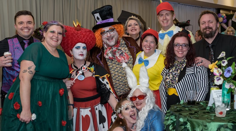 The eighth annual sold-out Dayton Adult Prom happened Feb. 28 at the Dayton Arcade in downtown Dayton. Hosted by Liftoff Entertainment and Dayton Arcade Events, proceeds from the prom benefit Ronald McDonald House Charities Dayton. This year’s prom theme was “A Night in Wonderland” (Alice in Wonderland). TOM GILLIAM/CONTRIBUTING PHOTOGRAPHER