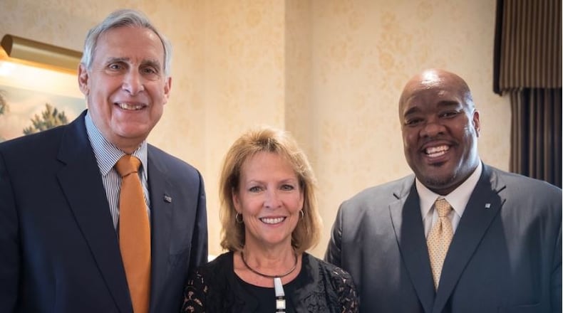 Former United Way CEO Rob Reifsnyder (from left); board chair Julia Poston; and Michael Johnson.