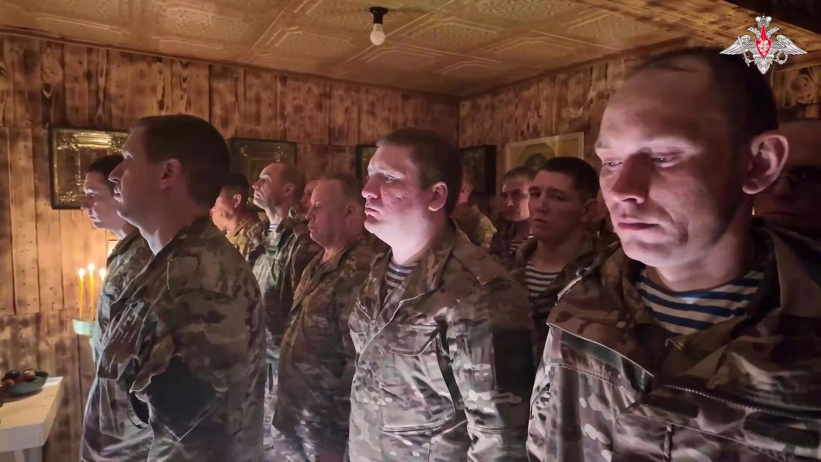 In this image from video distributed by the Russian Defense Ministry Press Service on Sunday, April 20, 2025, Russian soldiers attend a religious service on eve of Orthodox Easter at an unspecified location in Ukraine. (Russian Defense Ministry Press Service via AP)