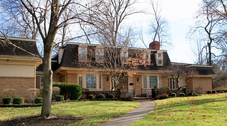 Located within the Singing Woods subdivision of Harrison Twp., this 2-story home features a first-floor main bedroom suite, a great room with sunken wet bar, a finished basement with recreation room and 4 upstairs bedrooms. CONTRIBUTED PHOTOS BY KATHY TYLER