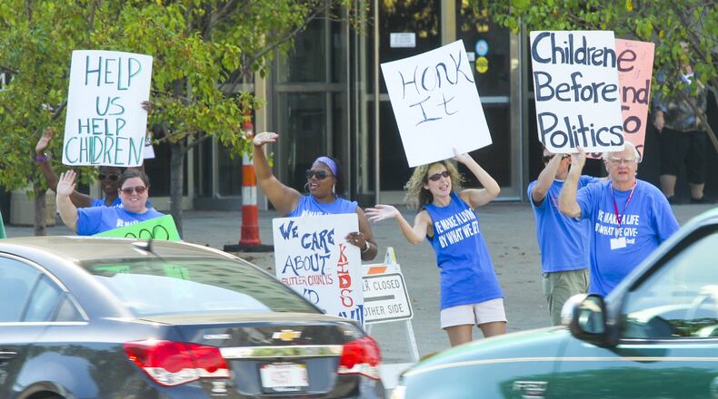 Butler County Children Services union President Becky Palmer requested supporters to come out and picket with them outside the Government Services Building in Hamilton on Thursday, Sept. 4, 2014. It was the last strike by Children Services workers in Ohio, but Montgomery County workers have filed a notice to strike later this month. GREG LYNCH / STAFF