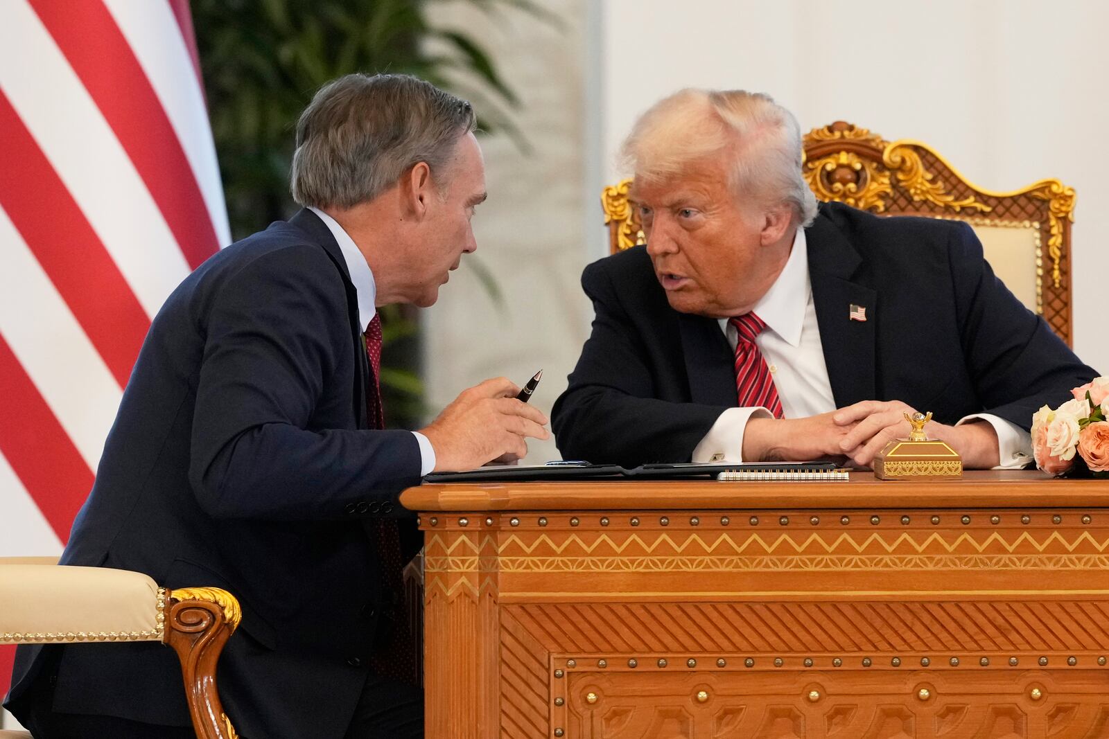 Kelly Ortberg, President and Chief Executive Officer, The Boeing Company, left, speaks President Donald Trump during a signing ceremony at the Amiri Diwan in Doha, Qatar, Wednesday, May 14, 2025. (AP Photo/Alex Brandon)
