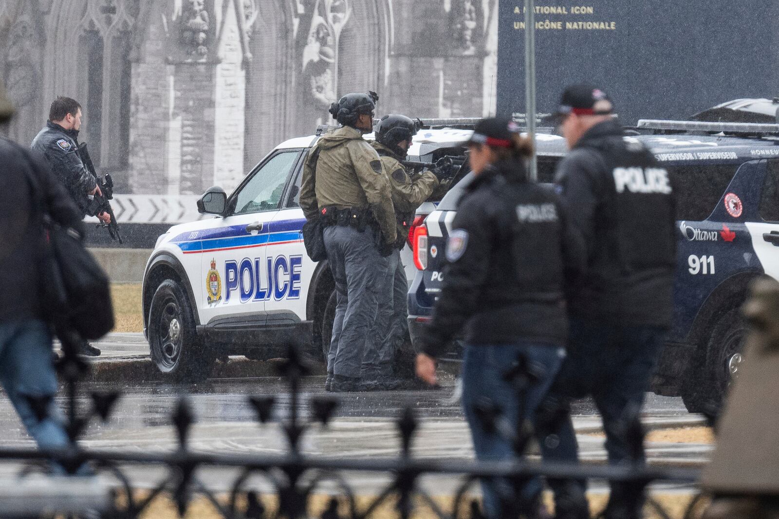 Ottawa police officers work the scene after a man barricaded himself in Parliament Hill in Ottawa, Ontario, Saturday, April 5, 2025. (Spencer Colby/The Canadian Press via AP)