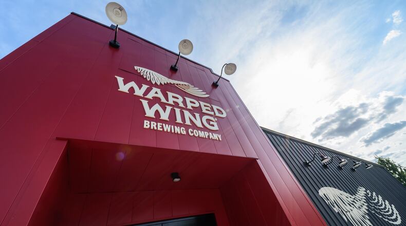 Warped Wing Brewing Company is holding a grand opening for its newest brewery and taproom location in Huber Heights on Friday, June 16. TOM GILLIAM / CONTRIBUTING PHOTOGRAPHER