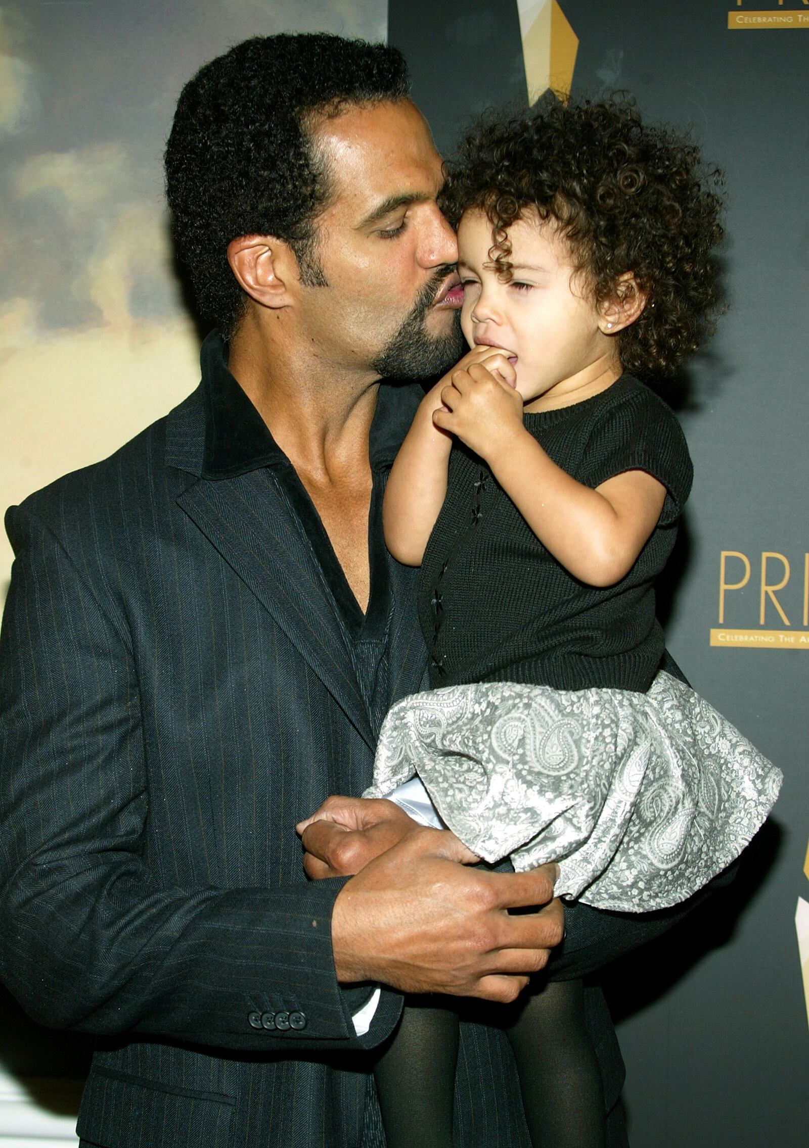 Kristoff St. John poses with daughter Lola as they arrive at the 9th Annual PRISM Awards, April 28, 2005 in Beverly Hills, Calif.