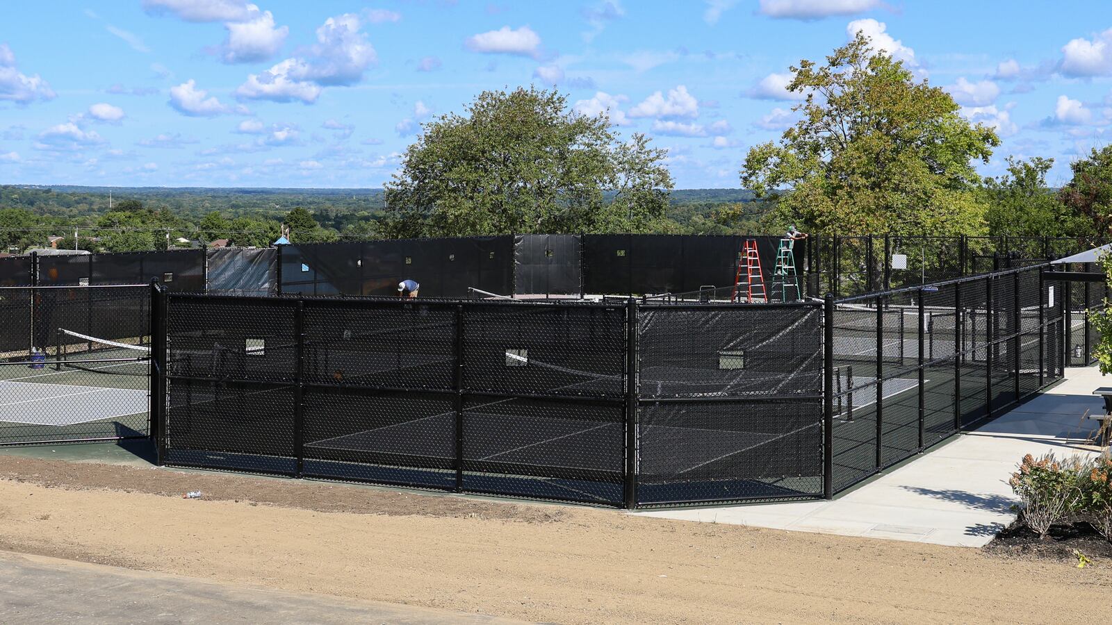 A nearly $10.2 million renovation effort at Miamisburg’s Sycamore Trails Park recently wrapped up ahead of a planned celebration of the site’s enhance features and added amenities. Workers were putting finishing touches on the site on Monday, Aug. 25. BRYANT BILLING / STAFF