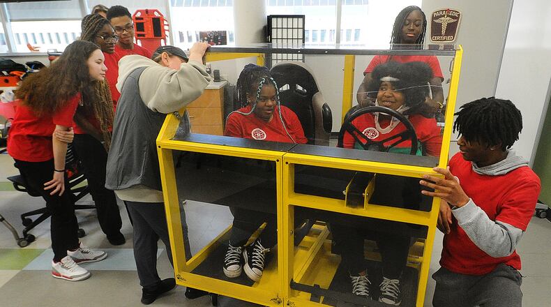 Trotwood High School students participate in a lab Tuesday, Feb. 13, 2024 as part of the Sinclair Emergency Medical Services Program. MARSHALL GORBY\STAFF