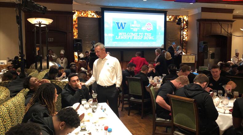 Urban Meyer talks to some of his Ohio State players during the annual Beef Bowl at Lawry's Prime Rib restaurant in Beverly Hills, Calif., on Dec. 27, 2018.