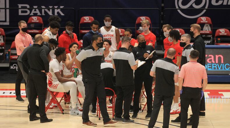 Dayton huddles during a game against Virginia Commonwealth on Tuesday, Feb. 9, 2021, at UD Arena in Dayton. David Jablonski/