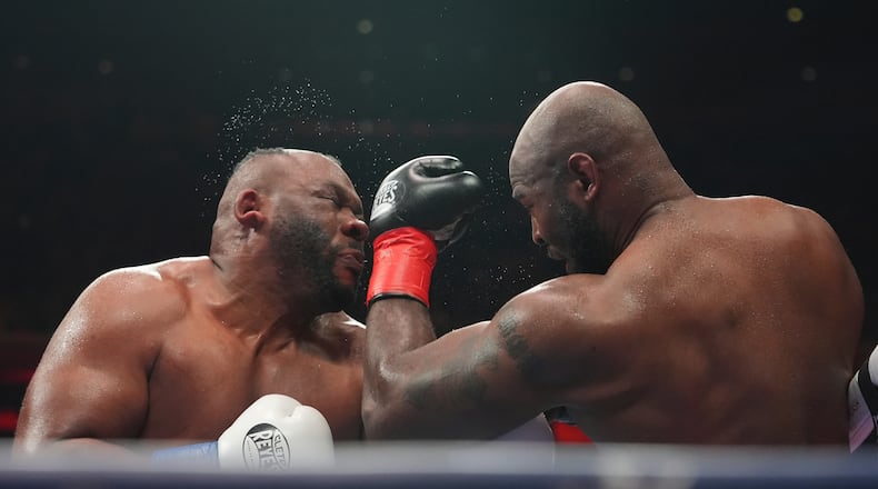 Kingsley Ibeh, right, punches Jarrell Miller during a heavyweight boxing match Saturday, Jan. 31, 2026, in New York. (AP Photo/Frank Franklin II)