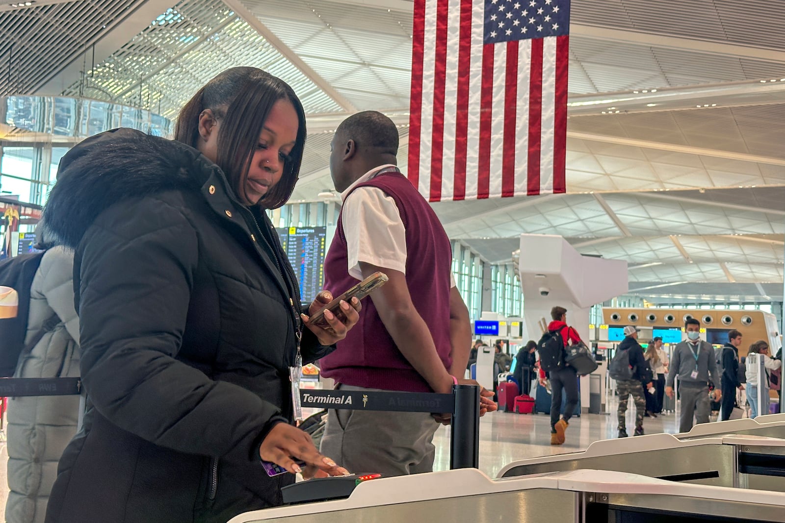 FILE - Departing air travelers enter the TSA PreCheck screening lane at Newark Liberty International Airport in New Jersey, Dec. 19, 2024. (AP Photo/Ted Shaffrey, File)