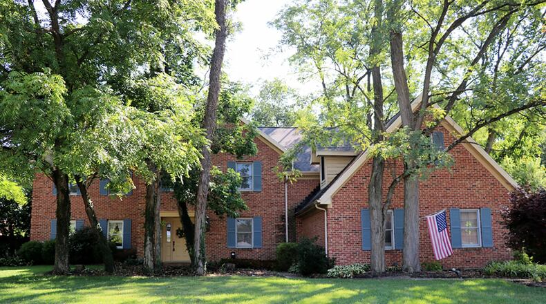 The brick home at 7032 Society Court has about 3,540 sq. ft. of living space with 4 bedrooms. It sits at the end of the cul-de-sac with a concrete driveway that leads up to a side-entry, 3-car garage. CONTRIBUTED PHOTO BY KATHY TYLER