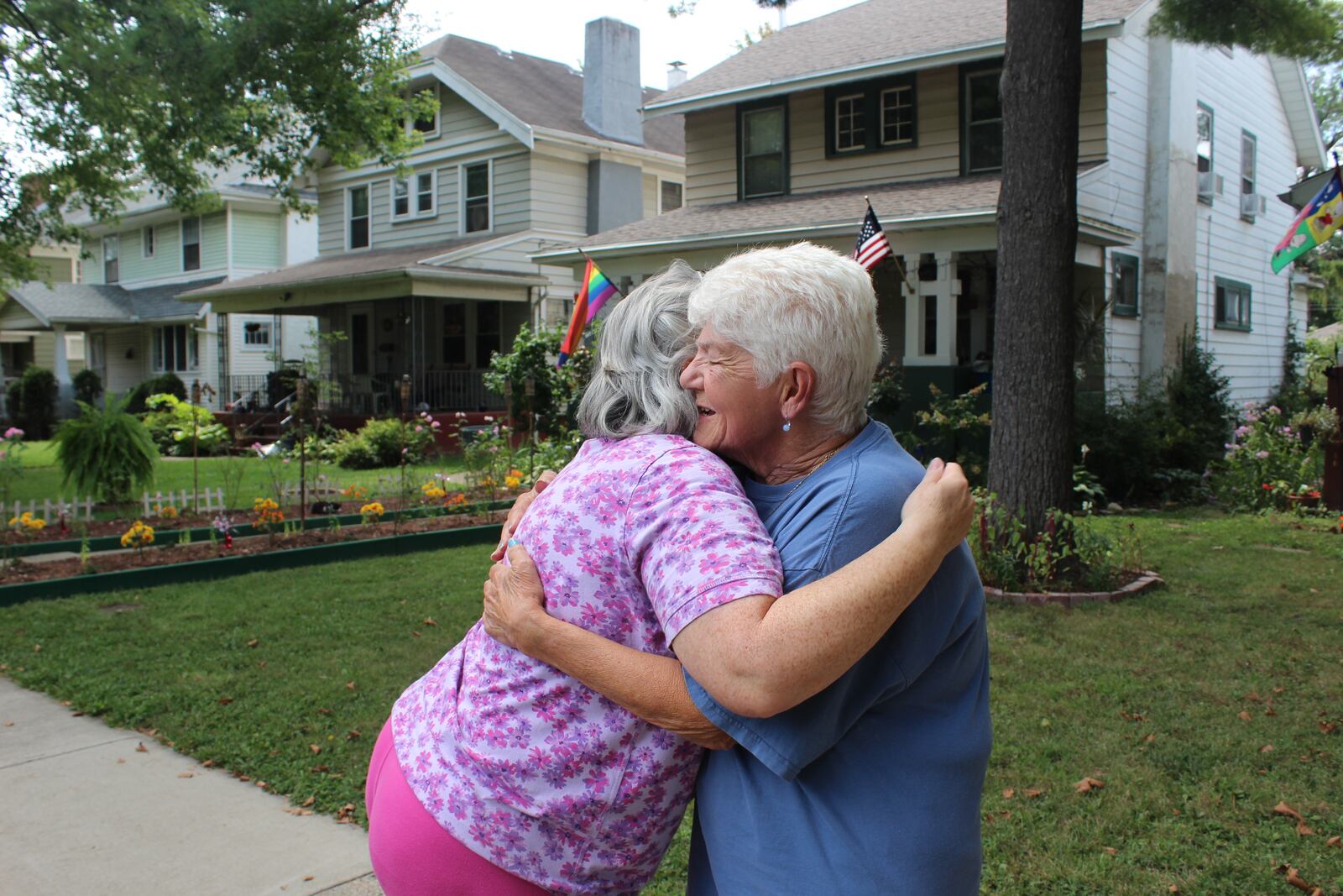 Dayton Wroe Avenue will celebrate the 50th anniversary of its  Labor Day weekend Block party on Sunday, Aug 3, 2017. Pictured: Wroe Avenue residents  Barbara Richardson greets neighbor Virginia Platt Gehres. Richardson is a block party founder. Gehres was raised on the street and now calls it home.