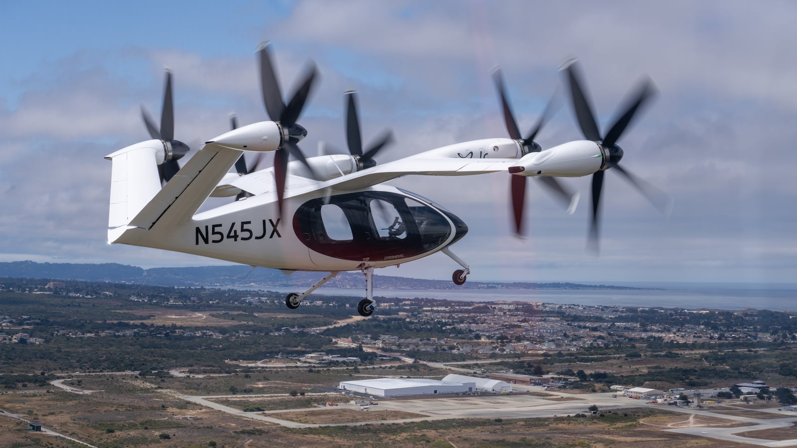 Joby’s new aircraft in flight over its expanded facility in Marina, California. Courtesy of Joby Aviation.